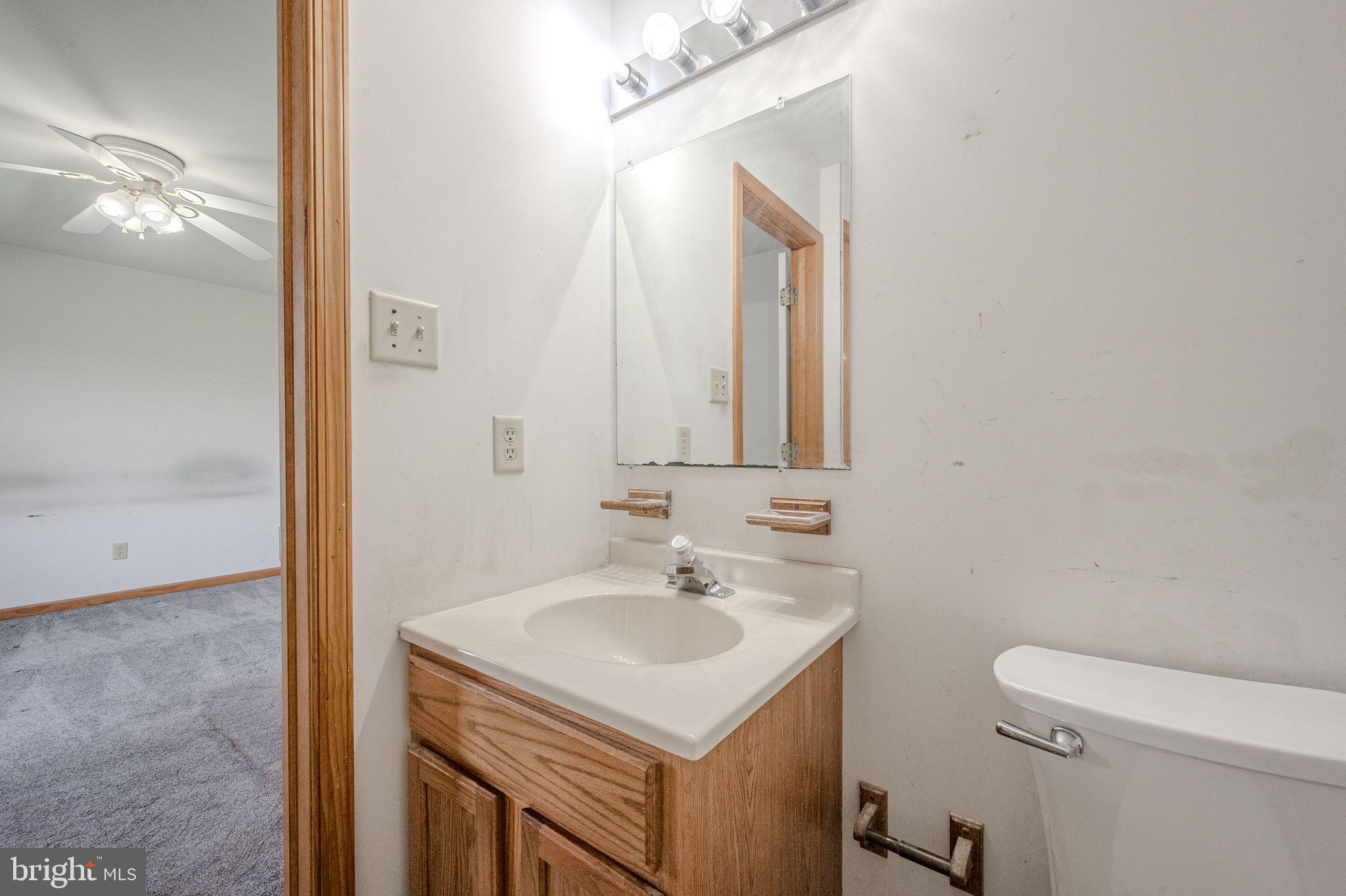 6 Windsor Court Elkton, MD 21921 - Photo 23 of 37 a bathroom with a sink toilet and mirror