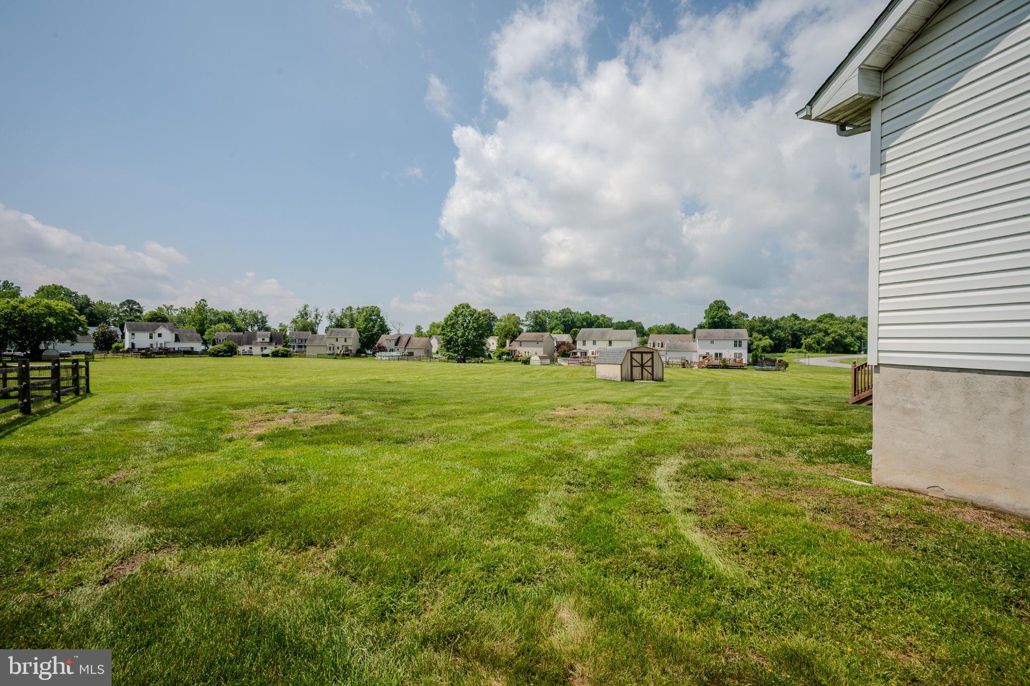 6 Windsor Court Elkton, MD 21921 - Photo 32 of 37 a view of a green field with wooden fence