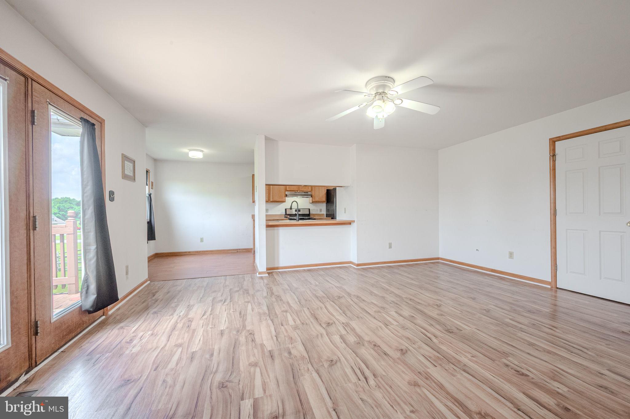 6 Windsor Court Elkton, MD 21921 - Photo 4 of 37 wooden floor in an empty room with a window