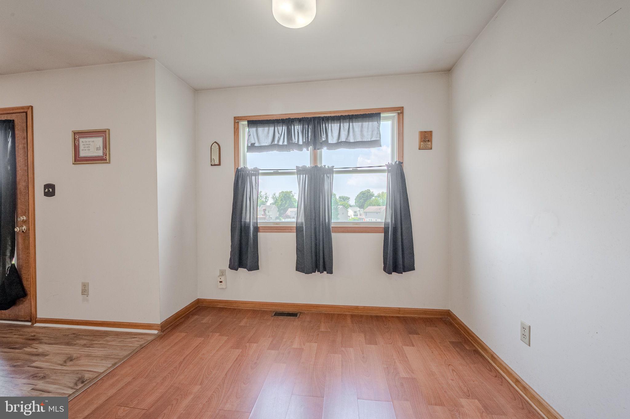 6 Windsor Court Elkton, MD 21921 - Photo 8 of 37 a view of empty room with wooden floor and fan
