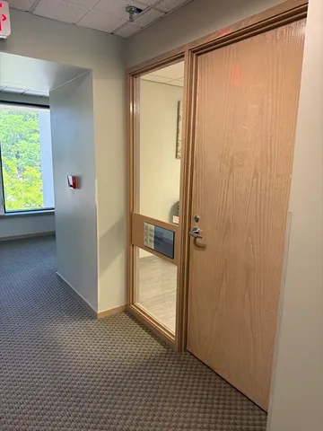 a workspace with furniture and window