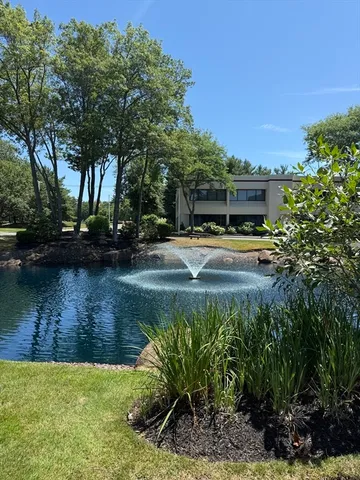 a view of a lake with a building in the background