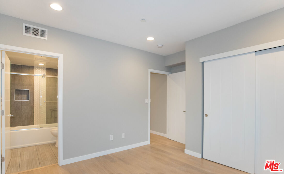 6546 La Mirada Avenue, Unit 6548 Los Angeles, CA 90038 - Photo 14 of 24 a view of hallway with wooden floor