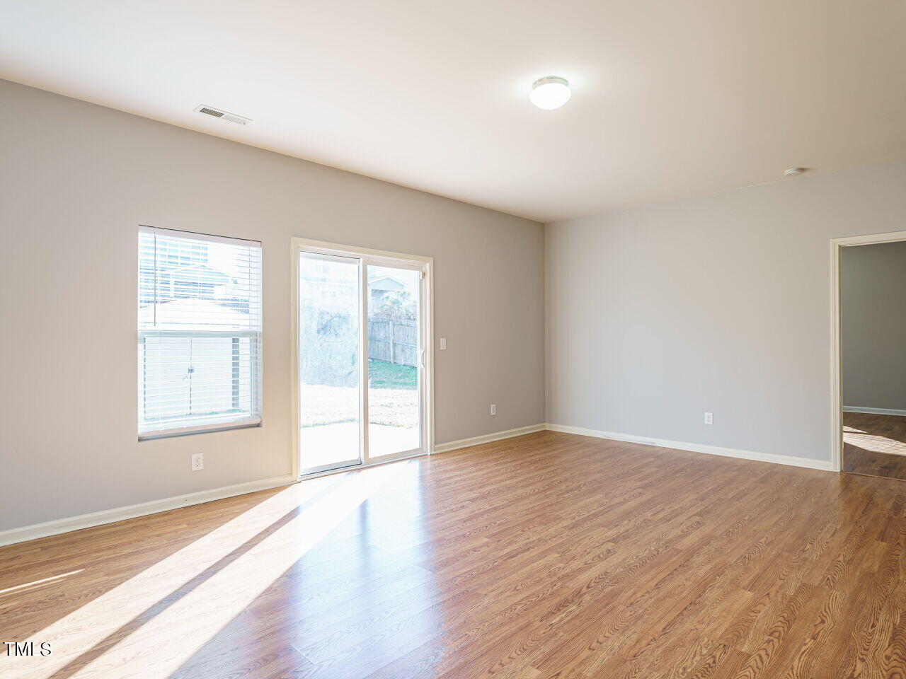 3709 Madeline Way Raleigh, NC 27610 - Photo 13 of 29 Living Rm/Sliders to backyard