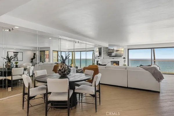 a kitchen with stainless steel appliances kitchen island granite countertop a refrigerator and a sink