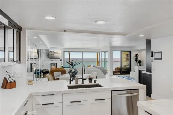 a kitchen with counter top space cabinets and stainless steel appliances
