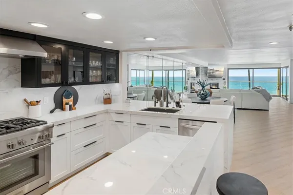 a stove top oven sitting inside of a kitchen