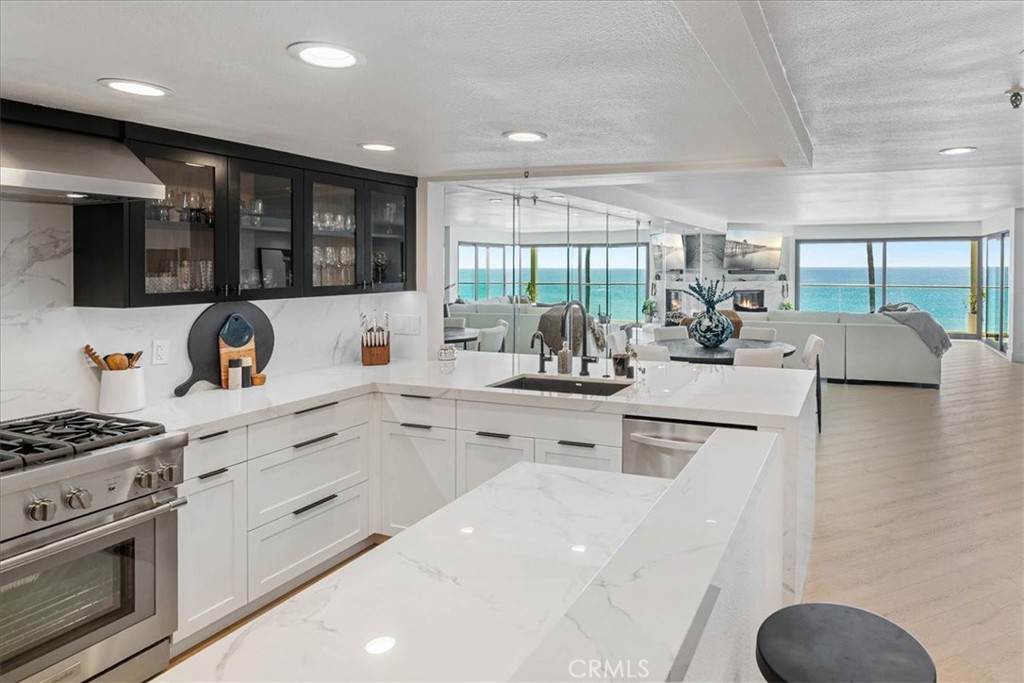 410 Corto Lane, Unit 9 San Clemente, CA 92672 - Photo 16 of 50 a kitchen with counter top space cabinets and stainless steel appliances