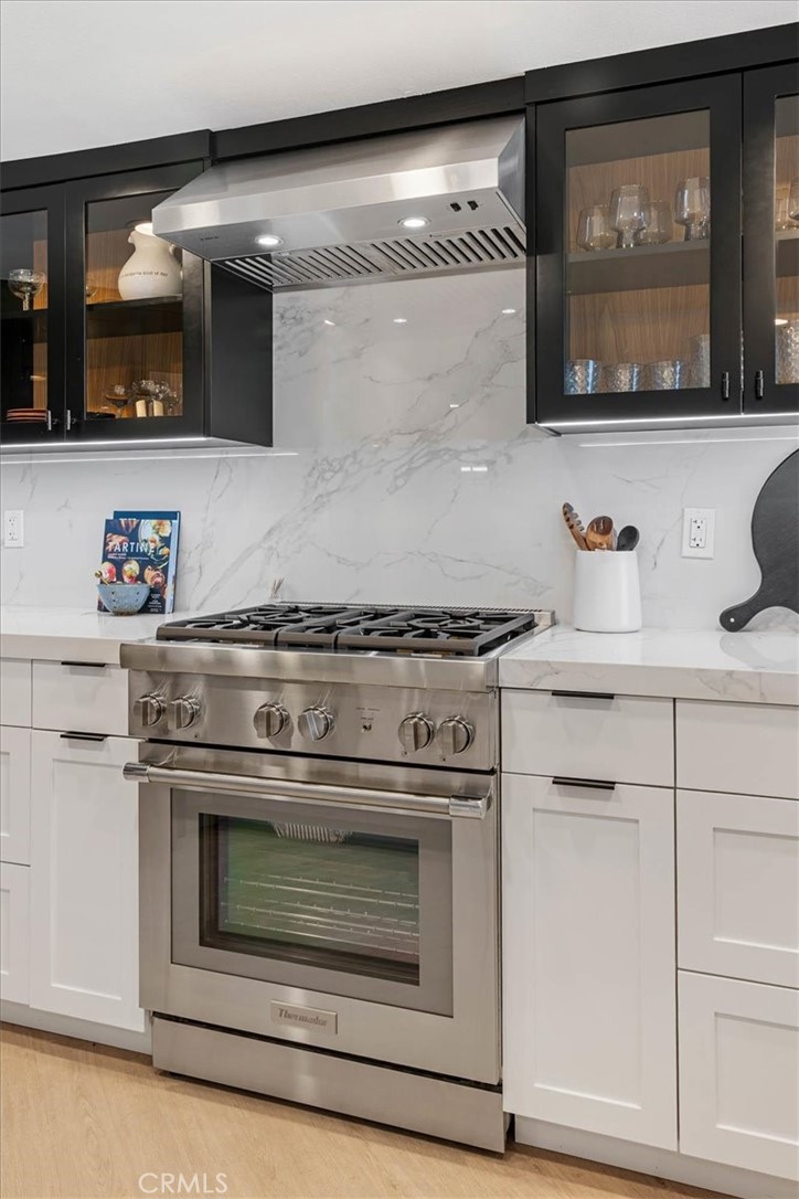 410 Corto Lane, Unit 9 San Clemente, CA 92672 - Photo 17 of 50 a stove top oven sitting inside of a kitchen
