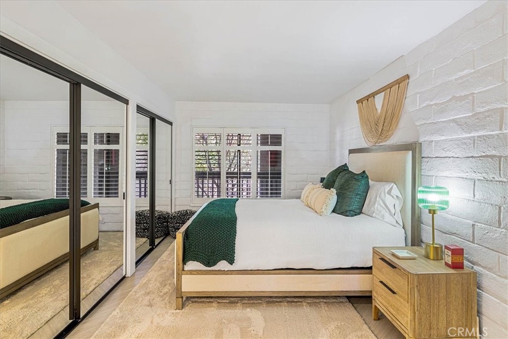 410 Corto Lane, Unit 9 San Clemente, CA 92672 - Photo 20 of 50 a bedroom with a bed and large window