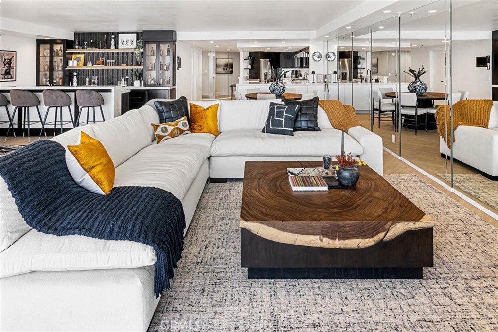 410 Corto Lane, Unit 9 San Clemente, CA 92672 - Photo 2 of 50 a living room with furniture and a book shelf