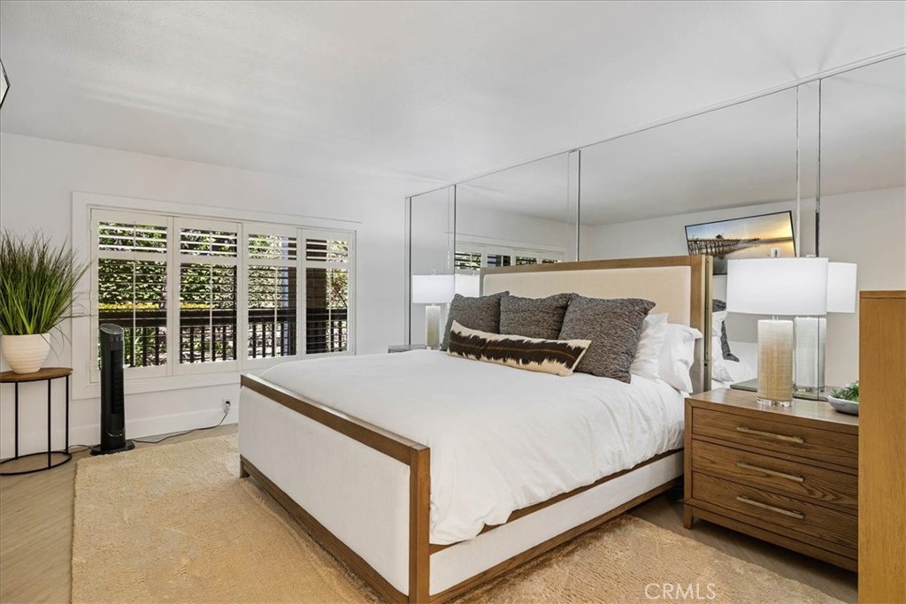 410 Corto Lane, Unit 9 San Clemente, CA 92672 - Photo 26 of 50 a bed room with a bed and a night stand