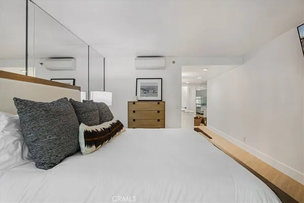 a bathroom with a double vanity sink a mirror and a shower