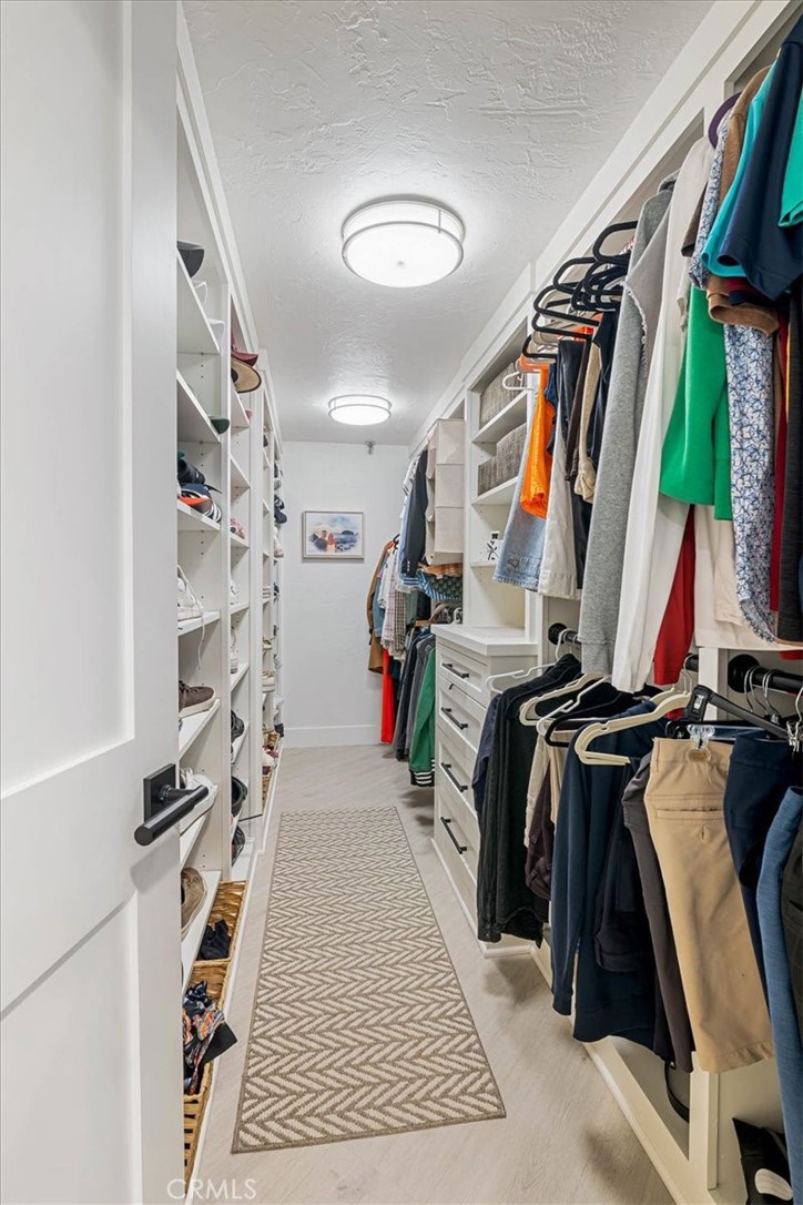 410 Corto Lane, Unit 9 San Clemente, CA 92672 - Photo 30 of 50 a view of walk in closet with clothes and shoes