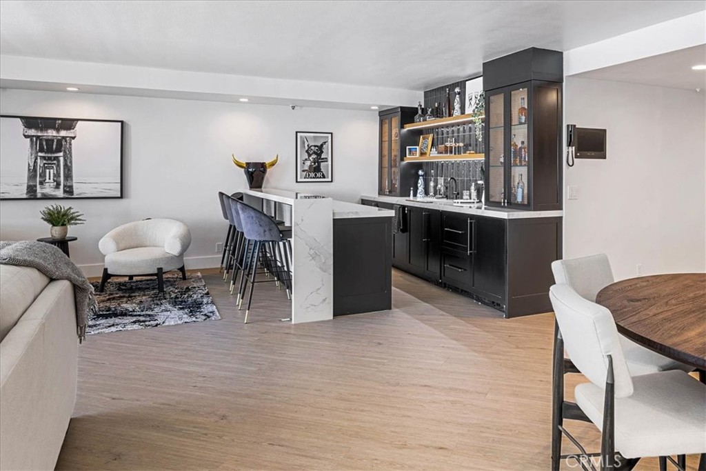 410 Corto Lane, Unit 9 San Clemente, CA 92672 - Photo 9 of 50 a living room with furniture and wooden floor