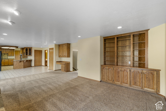 1373 Pheasant Ridge Circle Bountiful, UT 84010 - Photo 12 of 50 Built-in wood cabinetry and shelving, recessed lighting, and neutral-tone carpeting