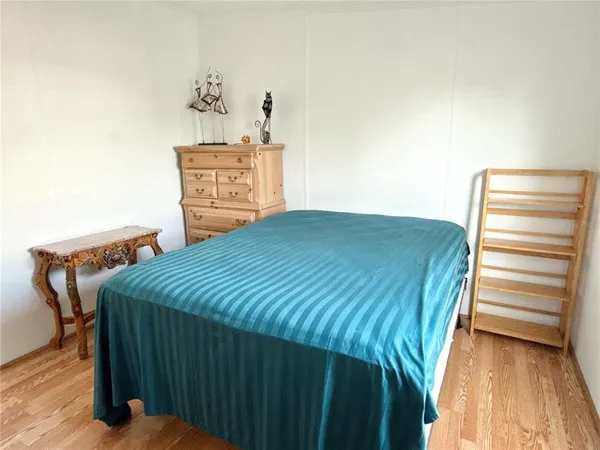 a bedroom with a bed and cabinets
