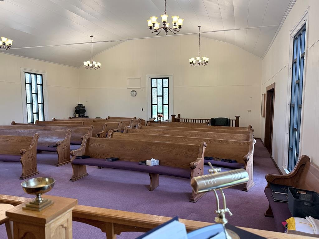 10926 Lafayette Road Herndon, KY 42236 - Photo 20 of 42 a living room with furniture a chandelier and a flat screen tv