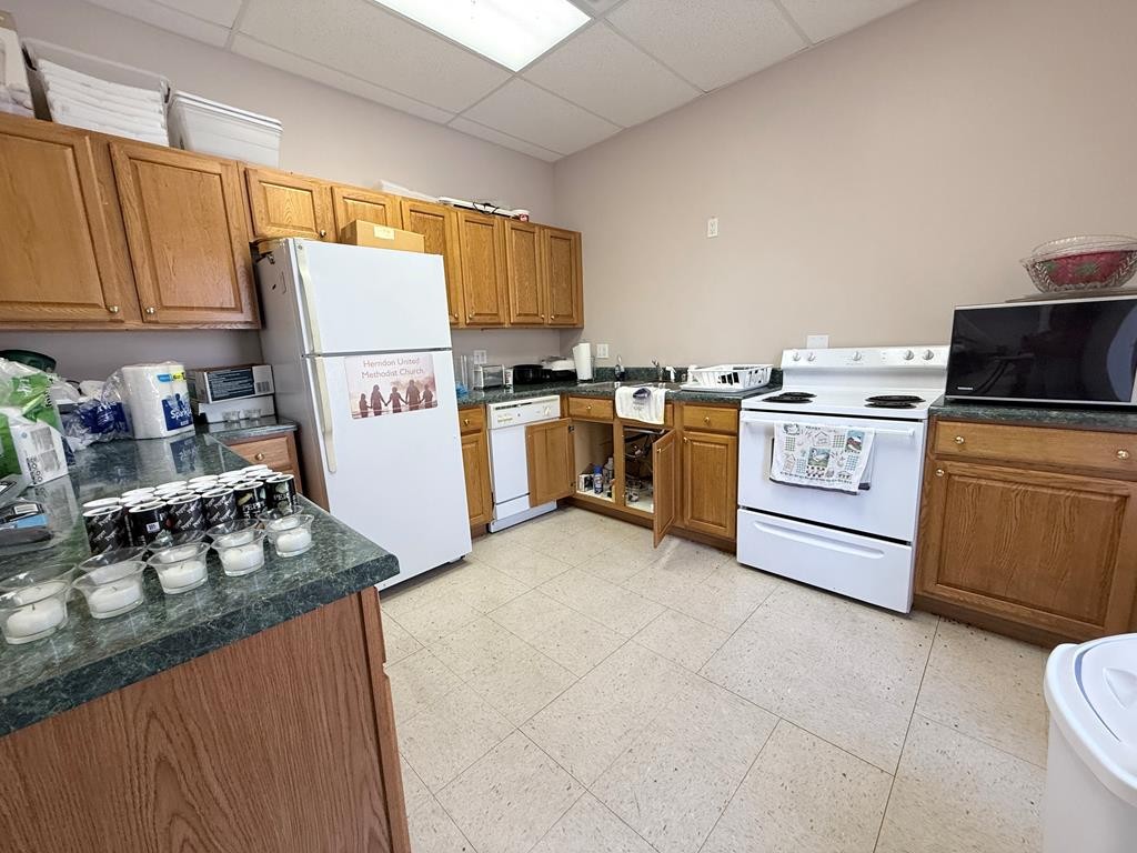 10926 Lafayette Road Herndon, KY 42236 - Photo 31 of 42 a kitchen with a stove a sink dishwasher and a refrigerator