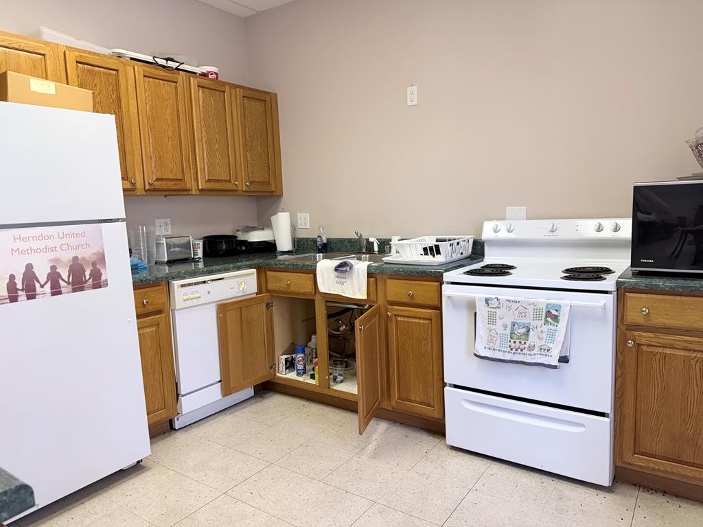 10926 Lafayette Road Herndon, KY 42236 - Photo 32 of 42 a kitchen with a stove top oven and cabinets