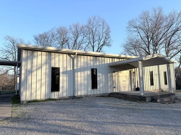 a front view of a house with a garage
