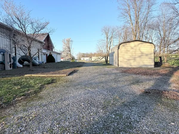 a view of a house with a snow in the yard