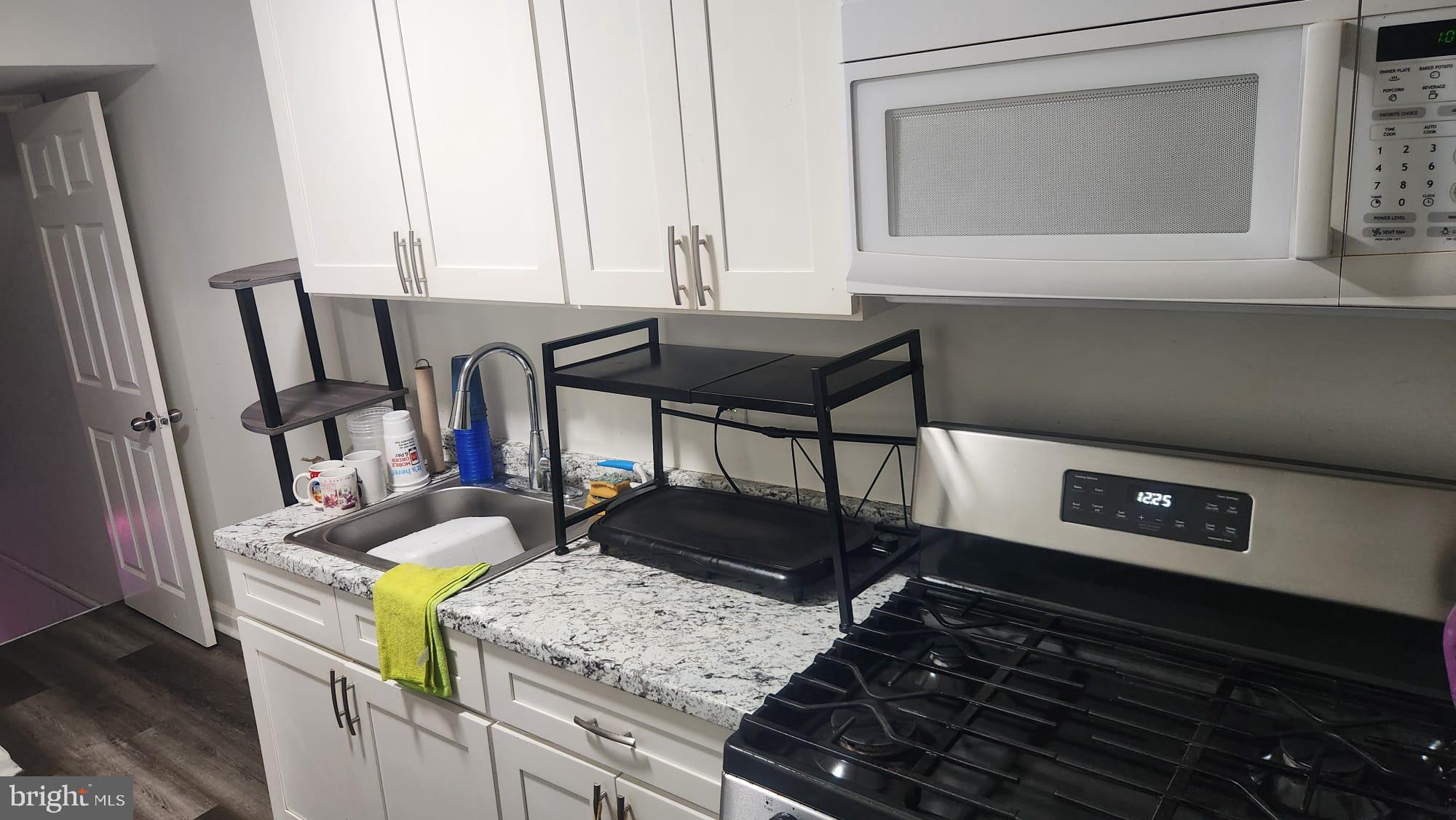 4432 Manorview Road Baltimore, MD 21229 - Photo 17 of 24 Modern kitchen with sleek finishes.