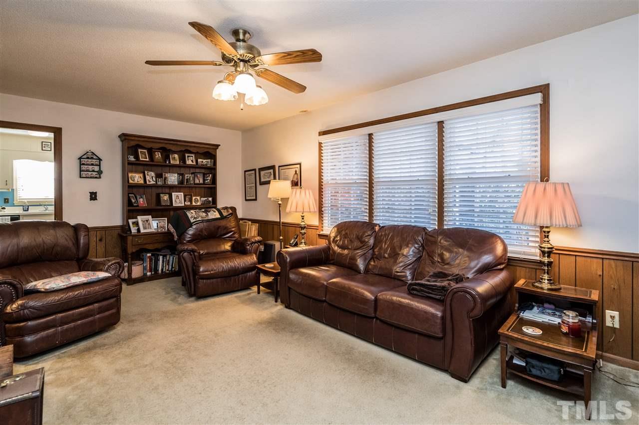 7301 Fiesta Way Raleigh, NC 27615 - Photo 7 of 25 a living room with furniture and a window