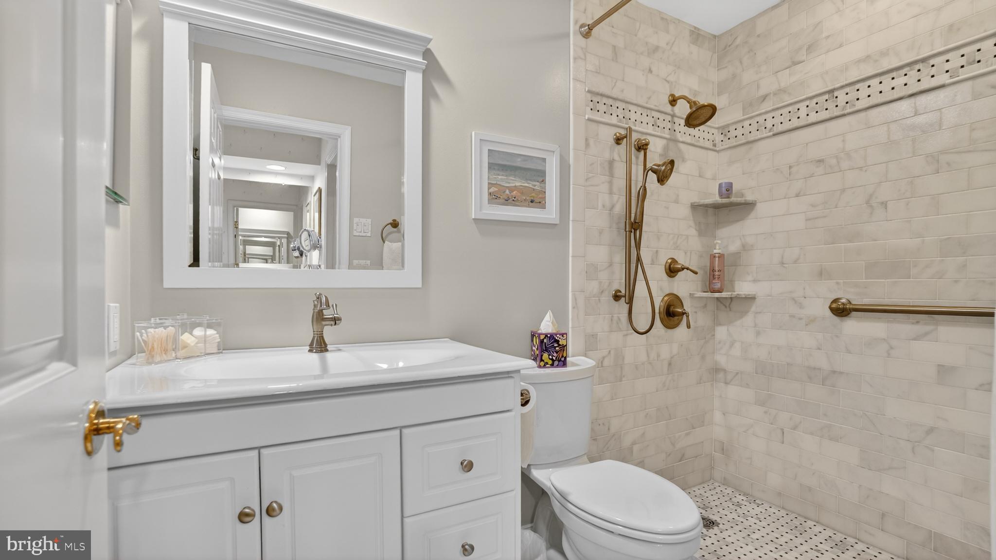 317 Canterfield Road Annapolis, MD 21403 - Photo 32 of 66 a bathroom with a sink toilet vanity and shower