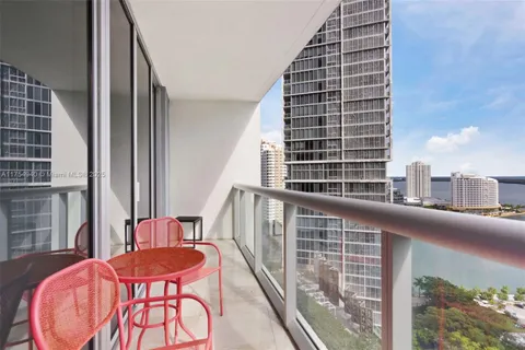 a view of balcony with furniture