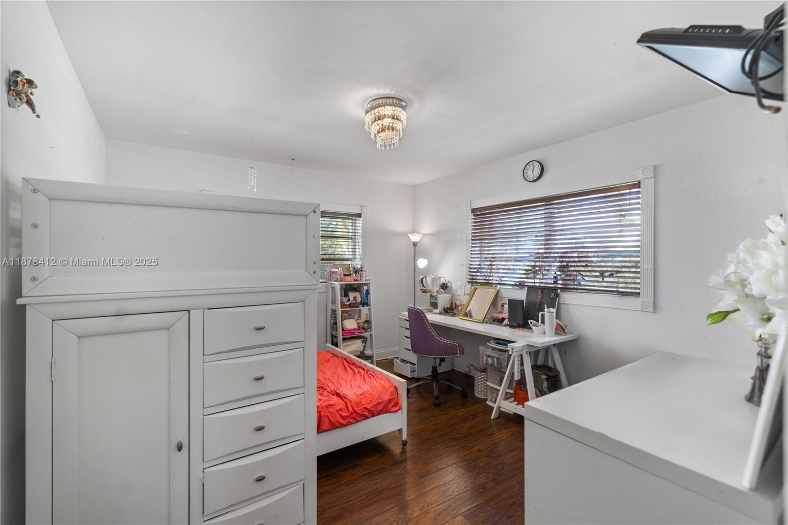 1710 Cleveland Road Miami Beach, FL 33141 - Photo 13 of 36 a room with furniture a desk and chair with wooden floor