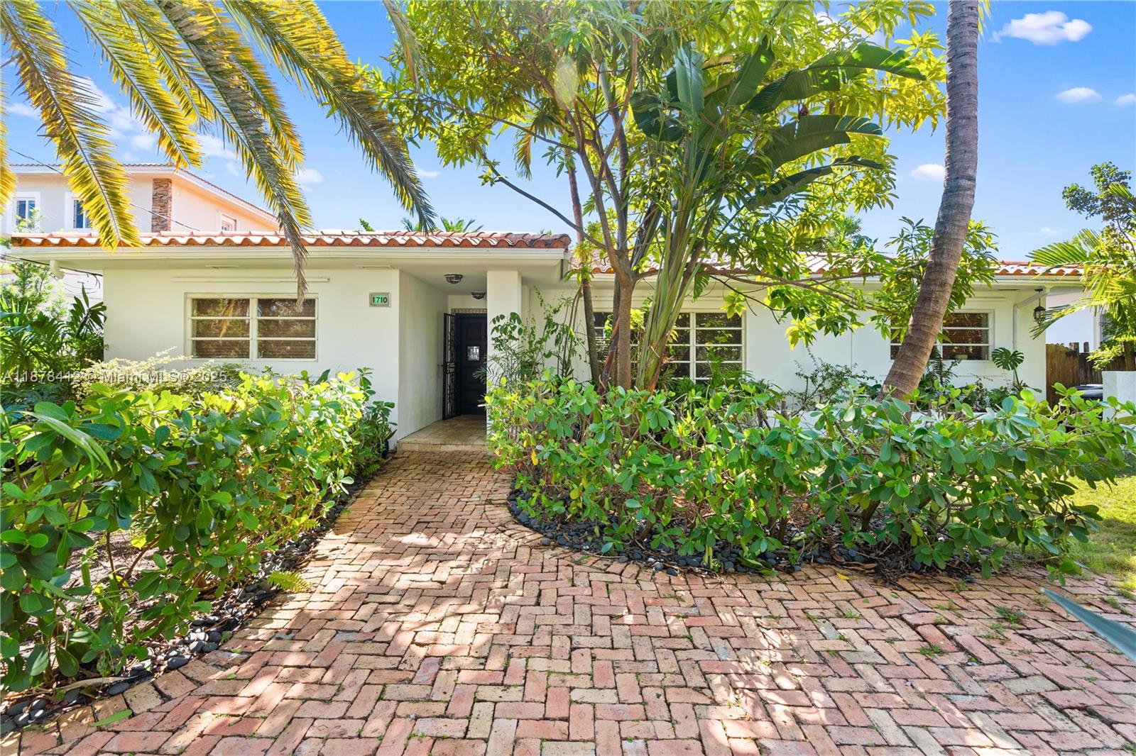 1710 Cleveland Road Miami Beach, FL 33141 - Photo 20 of 36 a front view of a house with garden