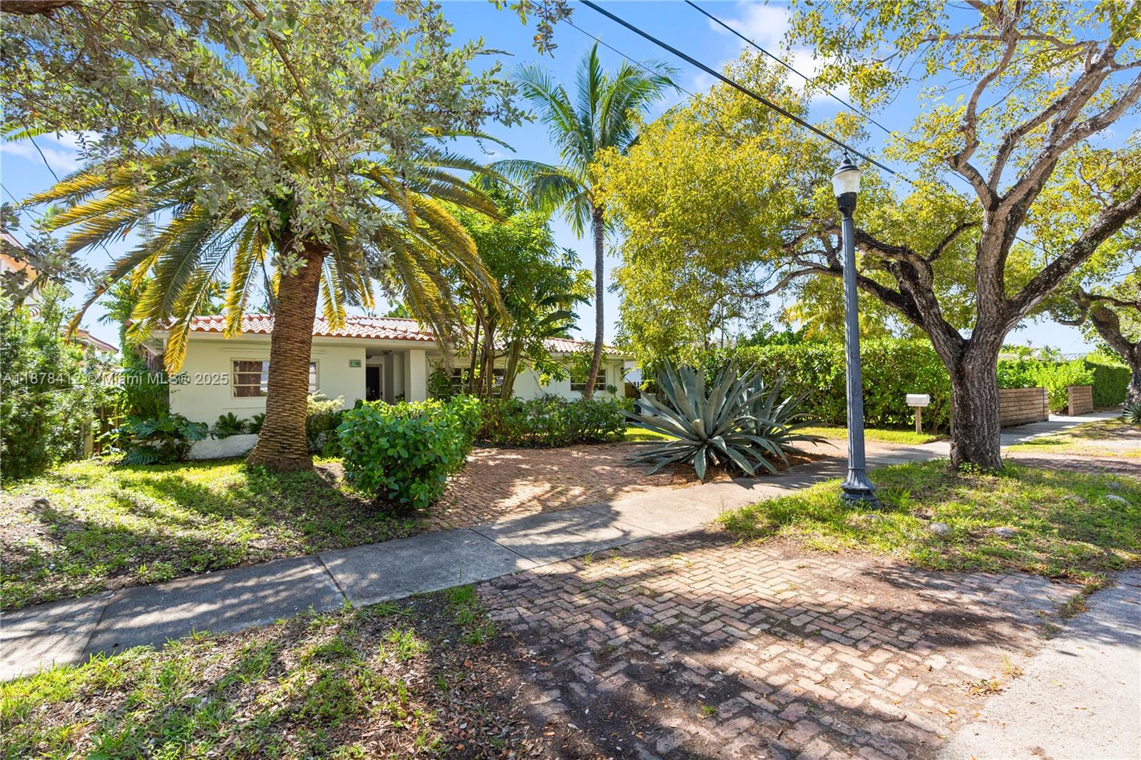 1710 Cleveland Road Miami Beach, FL 33141 - Photo 23 of 36 a view of a house with a tree in the yard