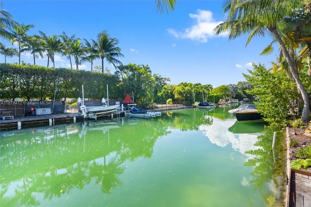 a swimming pool with outdoor seating and yard