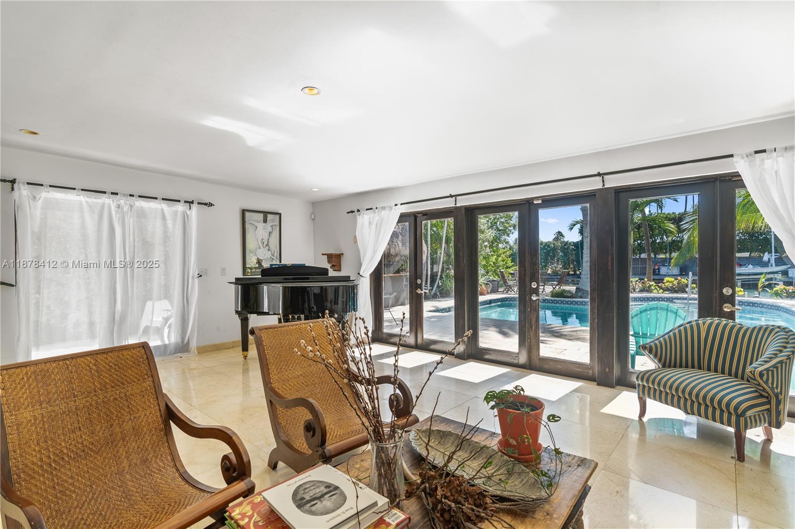 1710 Cleveland Road Miami Beach, FL 33141 - Photo 25 of 36 a living room with furniture and a large window
