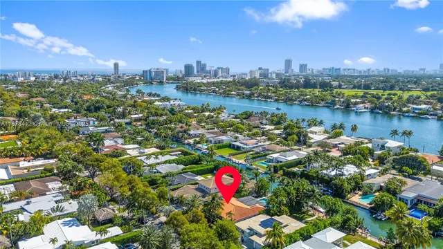 a bathroom with a toilet a sink and a mirror