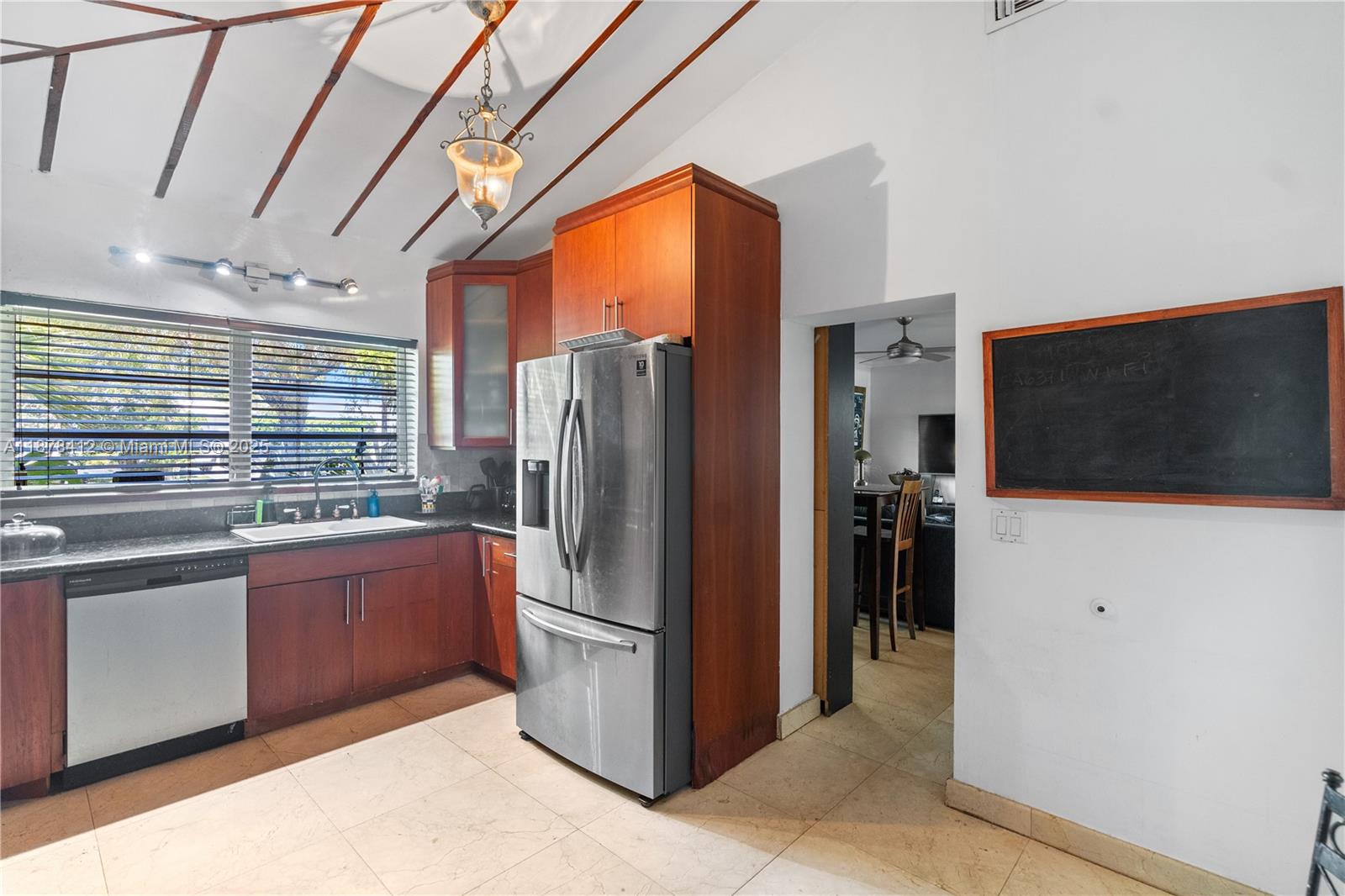 1710 Cleveland Road Miami Beach, FL 33141 - Photo 32 of 36 a kitchen with stainless steel appliances granite countertop a refrigerator and a stove