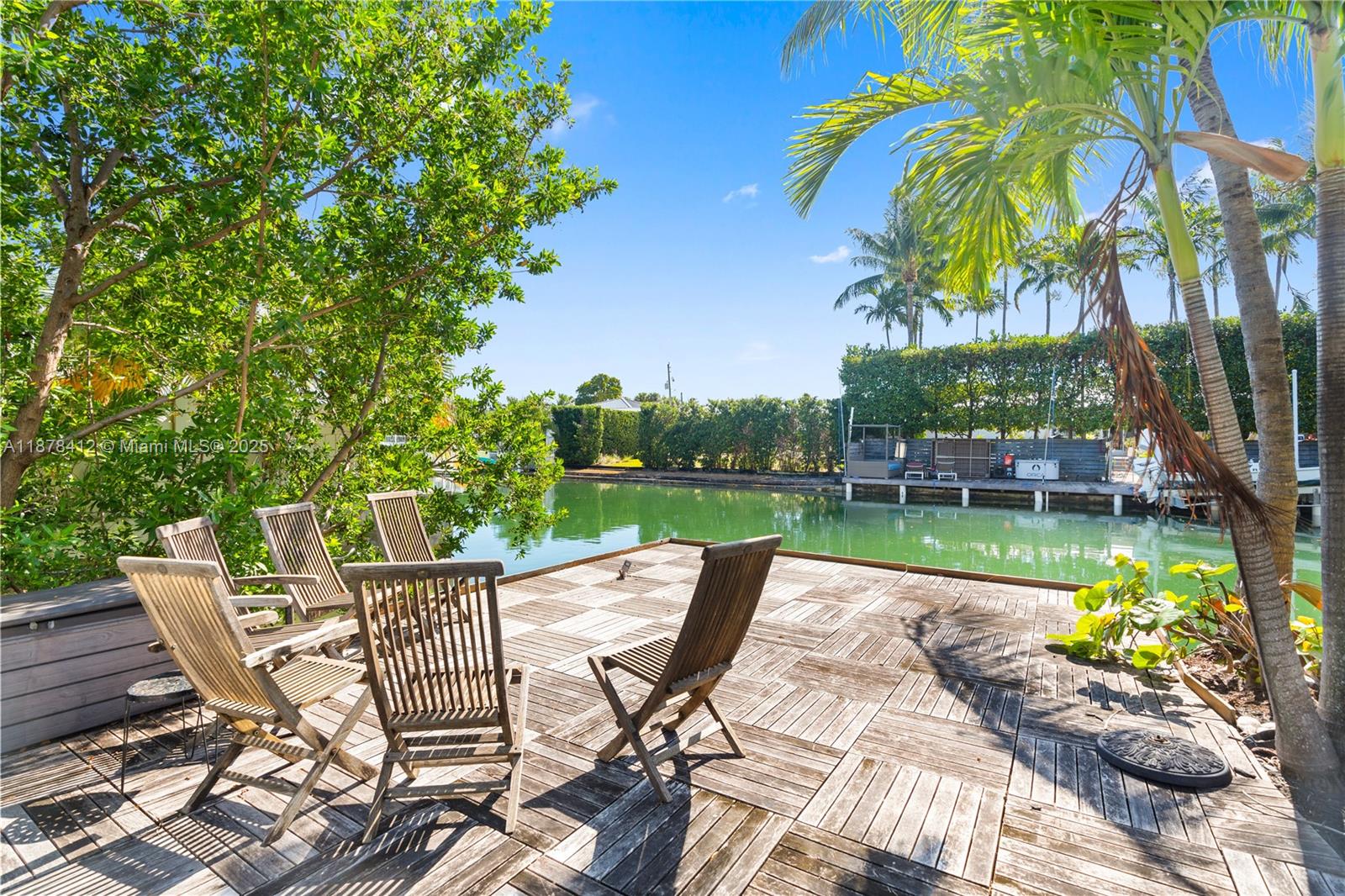 1710 Cleveland Road Miami Beach, FL 33141 - Photo 34 of 36 a view of a chairs and table in patio with a lake view
