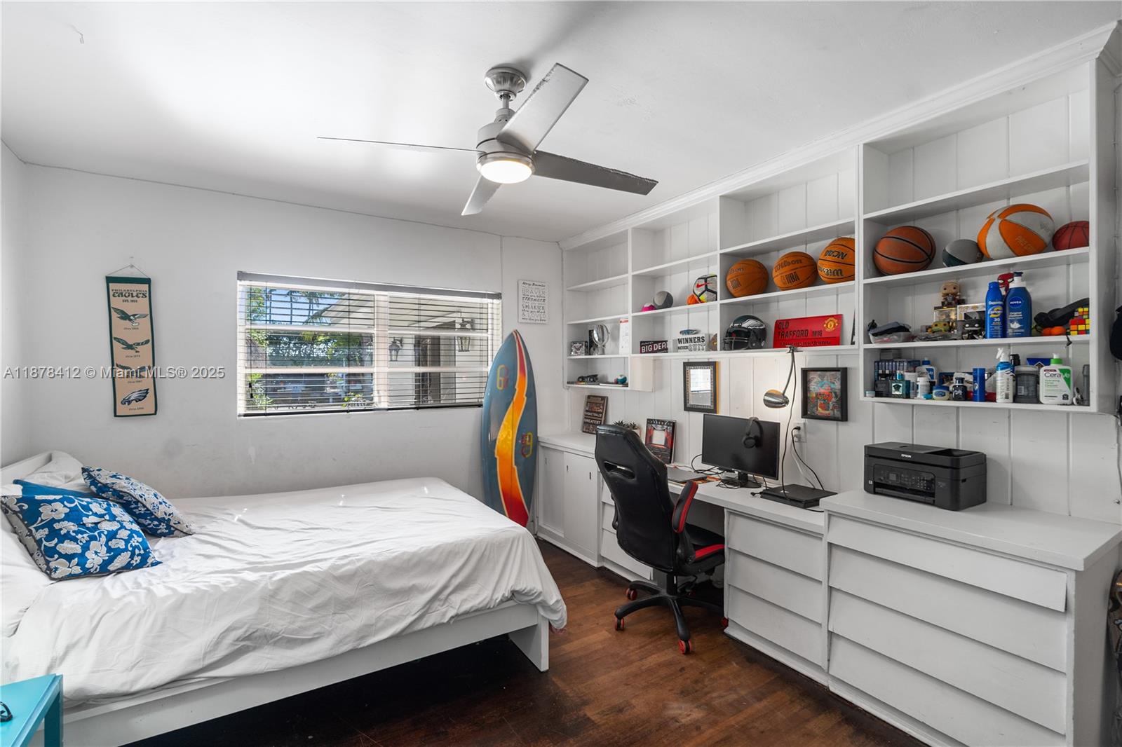 1710 Cleveland Road Miami Beach, FL 33141 - Photo 35 of 36 a bedroom with bed and a book shelf