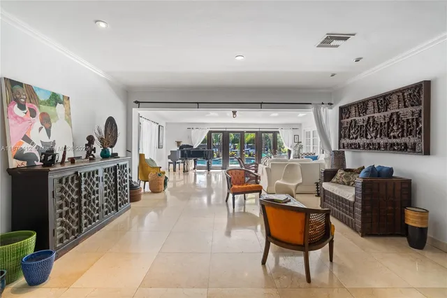 a living room with furniture a rug and a large window