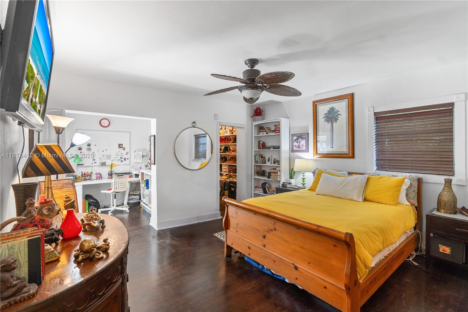 1710 Cleveland Road Miami Beach, FL 33141 - Photo 5 of 36 a bedroom with a bed and a chandelier