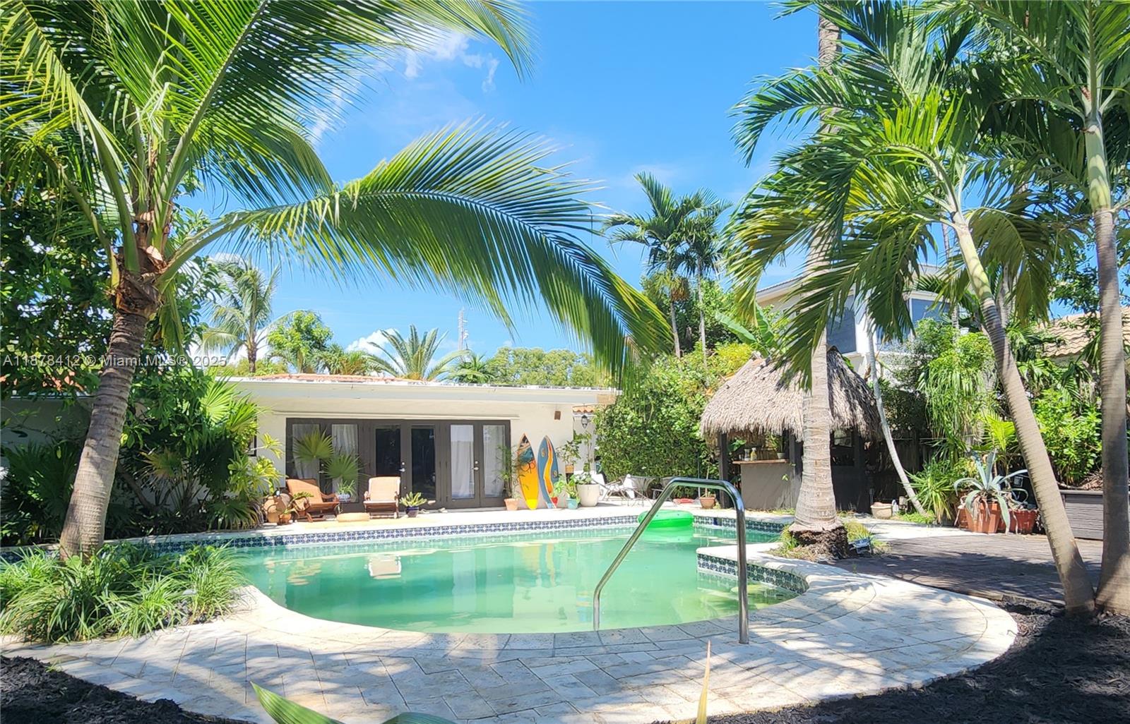 1710 Cleveland Road Miami Beach, FL 33141 - Photo 7 of 36 a front view of house with yard swimming pool and outdoor seating