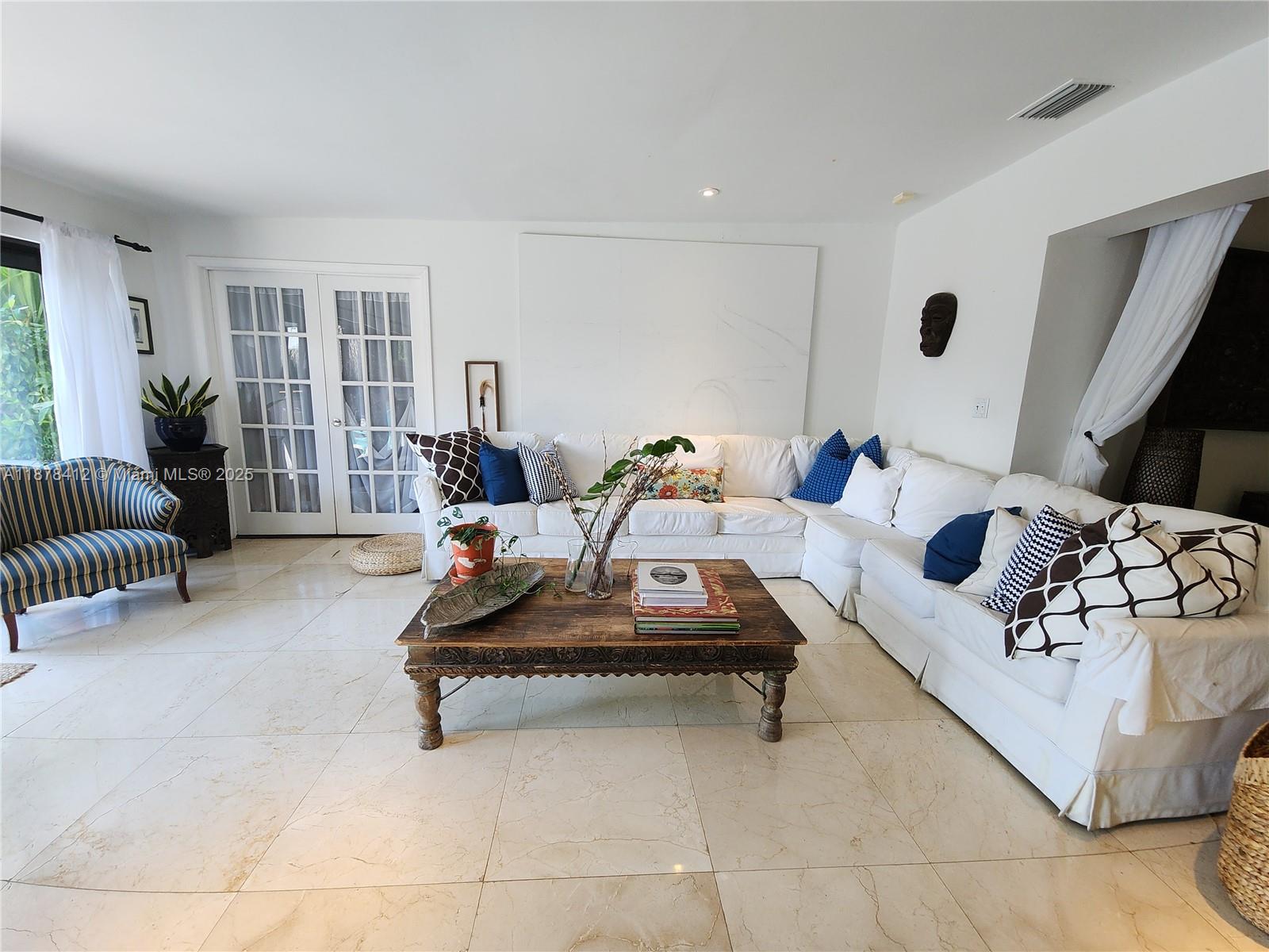 1710 Cleveland Road Miami Beach, FL 33141 - Photo 8 of 36 a living room with furniture and a couch