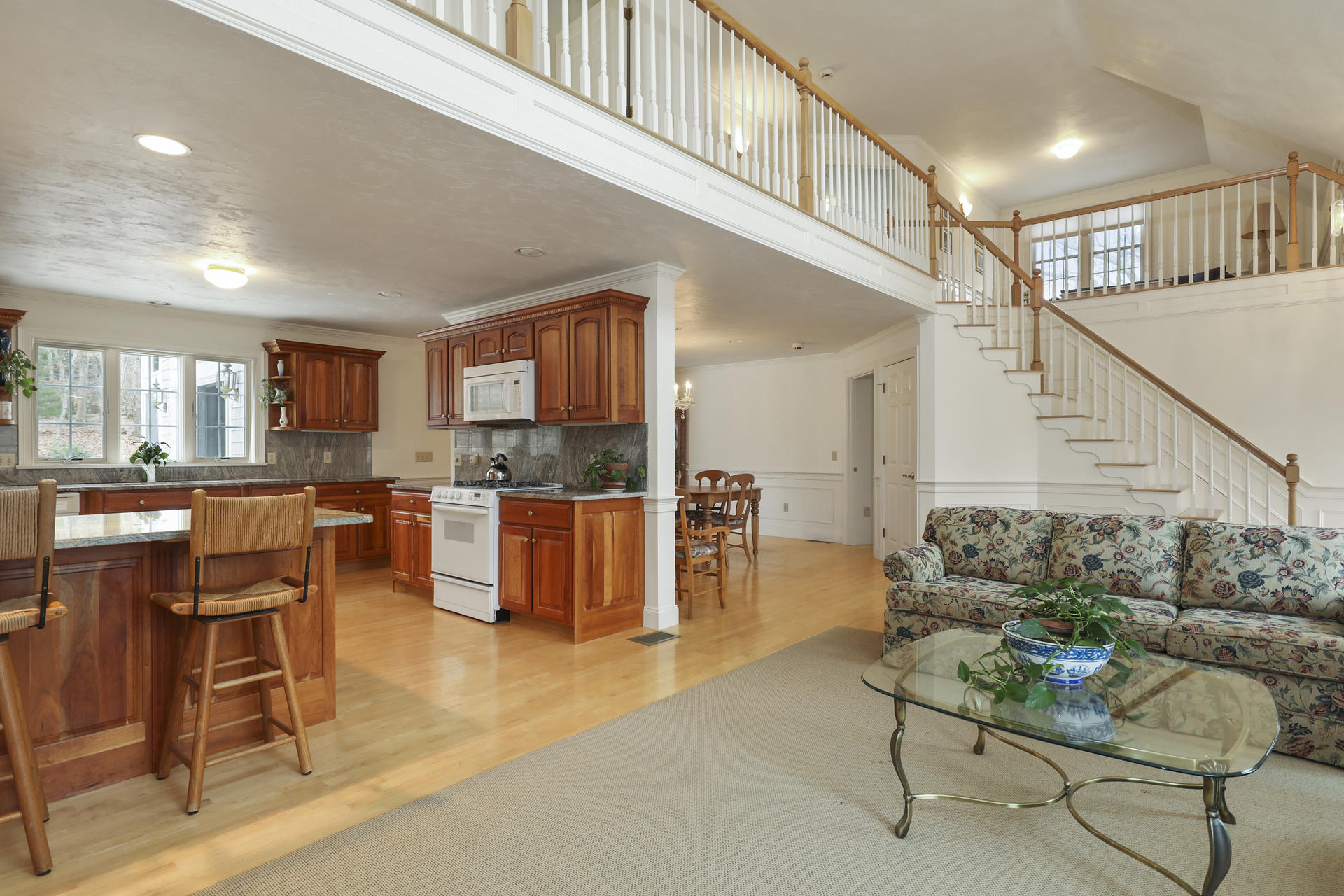 5 Scargo Heights Road Dennis, MA 02638 - Photo 3 of 29 a living room with furniture kitchen view and a wooden floor