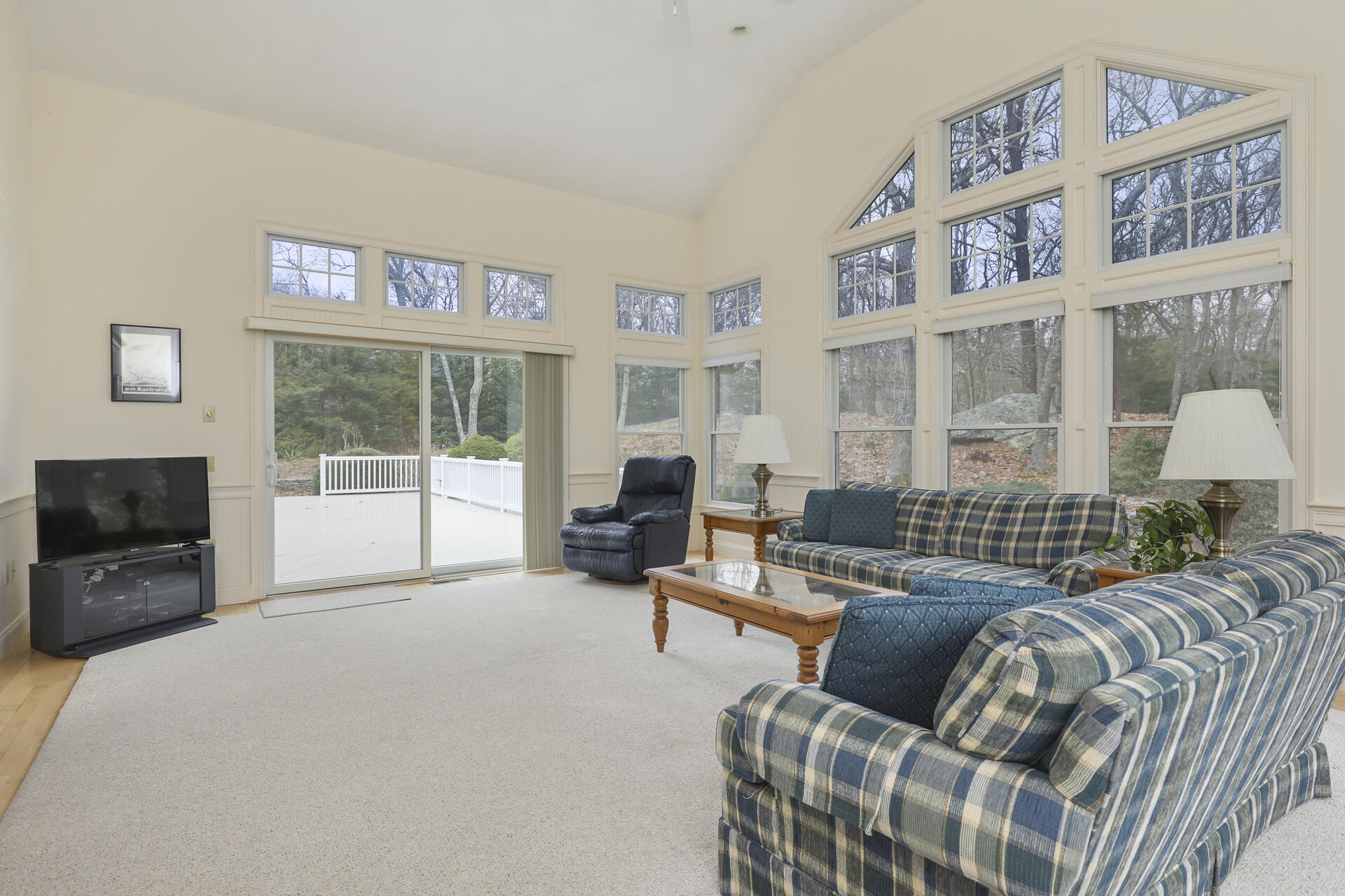 5 Scargo Heights Road Dennis, MA 02638 - Photo 7 of 29 a living room with furniture large window and flat screen tv