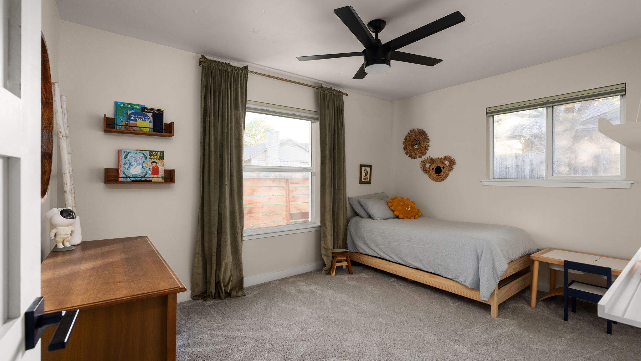 1602 Thornridge Road Austin, TX 78758 - Photo 28 of 39 Bedroom with light colored carpet, ceiling fan, and multiple windows