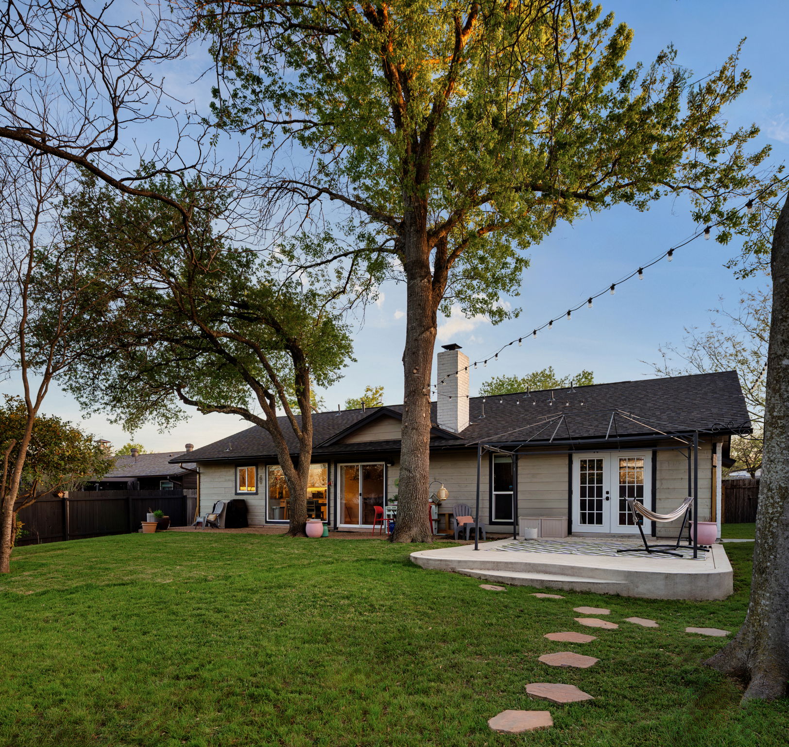 1602 Thornridge Road Austin, TX 78758 - Photo 29 of 39 Rear view of house with a fenced backyard, a patio area, a chimney, and french doors
