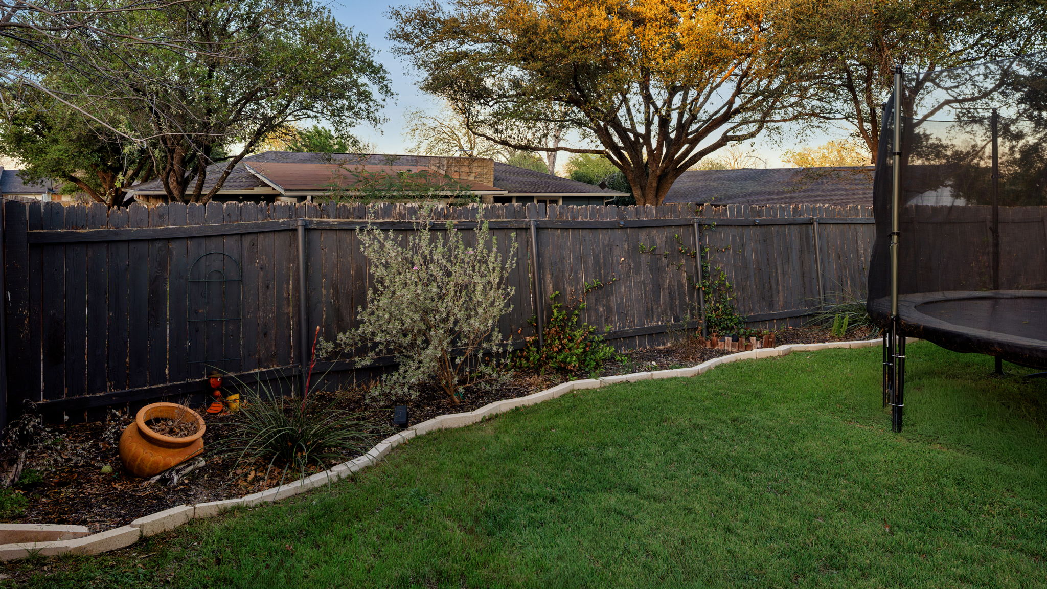 1602 Thornridge Road Austin, TX 78758 - Photo 37 of 39 Fenced backyard featuring a trampoline