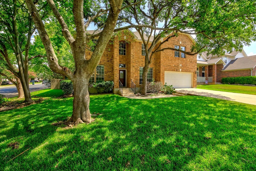 7910 Lecompte Road Austin, TX 78717 - Photo 1 of 1 a front view of a house with garden