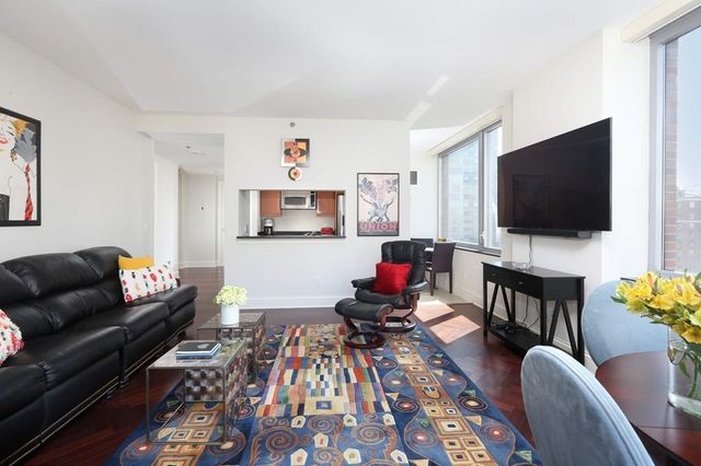 a kitchen with stainless steel appliances granite countertop a sink and a stove